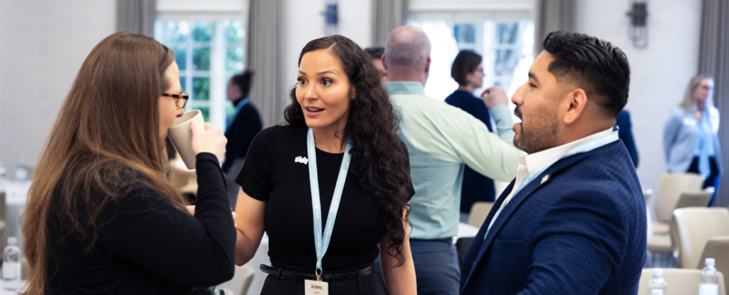 Professionals networking at an event.
